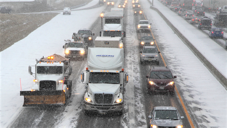 vehicles in snowy traffic