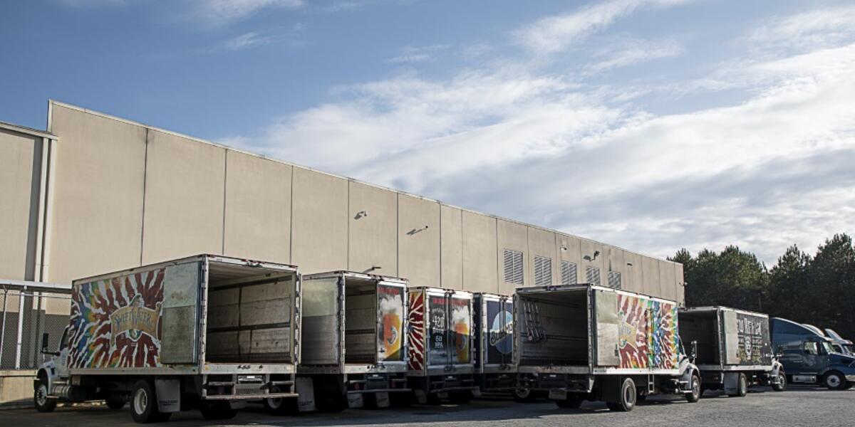 Commercial trucks at beverage company truck bays