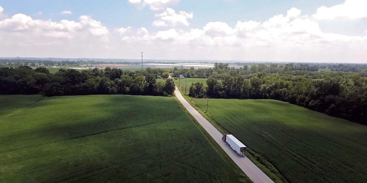 aerial view of tractor drivig on road