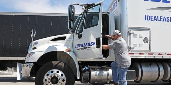 truck driver getting into truck