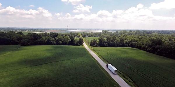 aerial view of tractor drivig on road