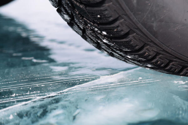 closeup of tire on frosted road